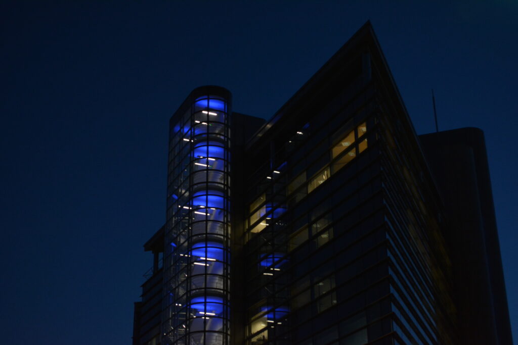 A photo of a tower block at nighttime